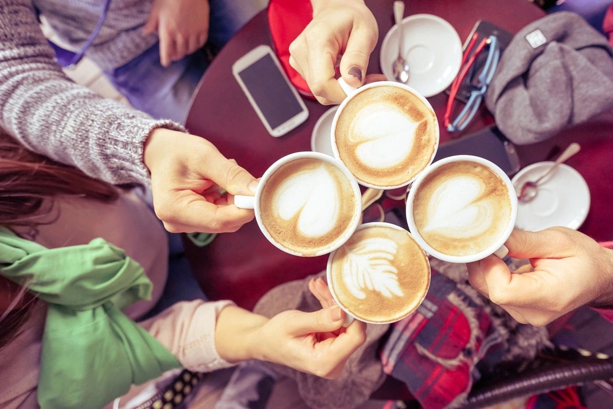 fm=f_o3p6jDY Group of friends drinking cappuccino at coffee bar restaurant - People hands cheering and toasting with upper view point - Social gathering concept with men and women - Vintage marsala filtered look (Group of friends drinking cappuccino at coffee bar